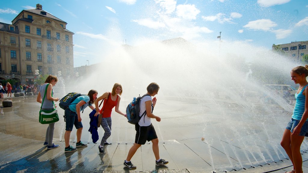 Karlsplatz - Stachus which includes a fountain, a square or plaza and a city