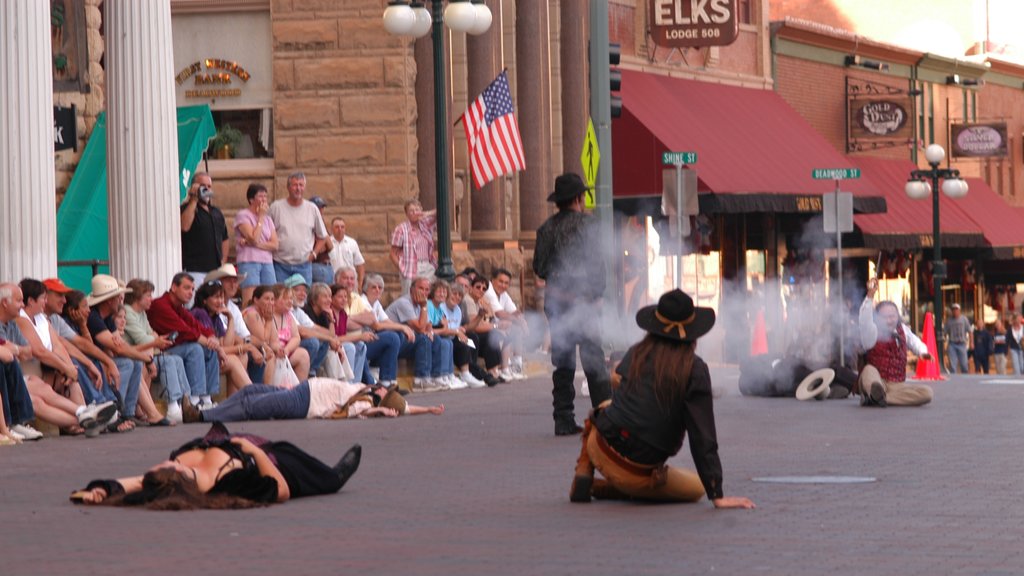 Deadwood showing street performance, a city and performance art