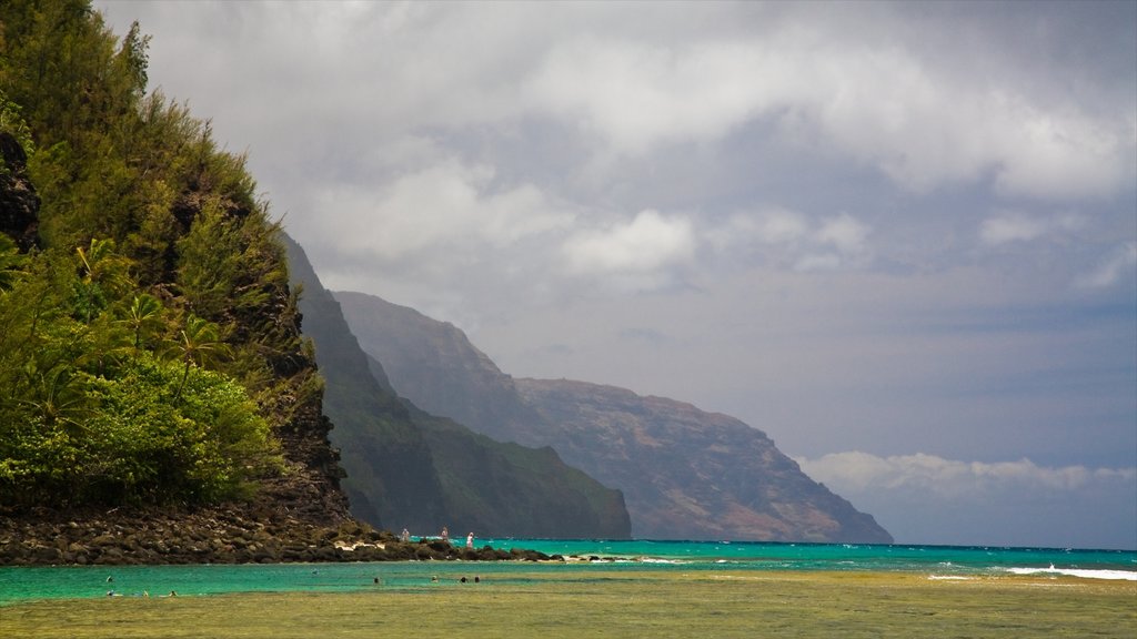 Haena featuring a beach, rocky coastline and mountains