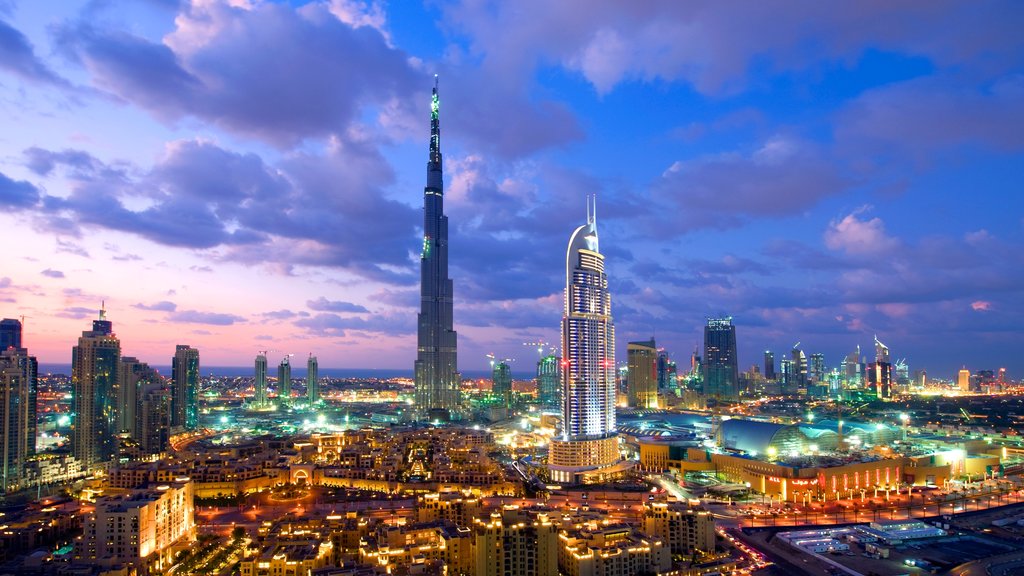 Dubai Emirate which includes skyline, a sunset and modern architecture