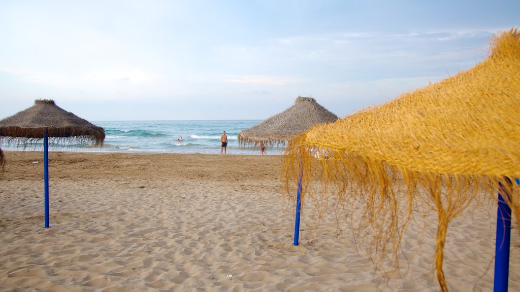 Malvarrosa Beach which includes a sandy beach and general coastal views