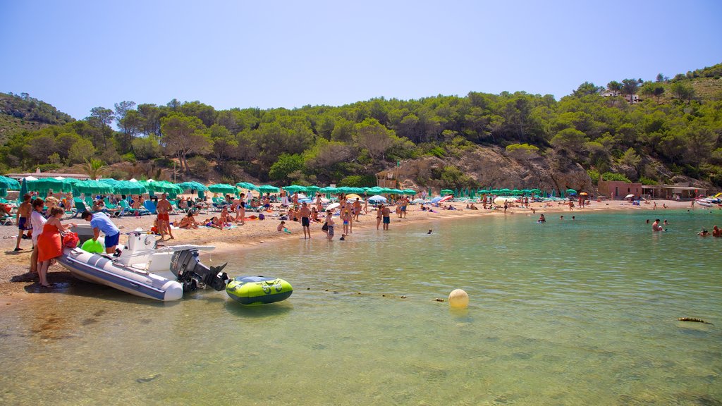 Benirras Beach showing boating, swimming and a beach