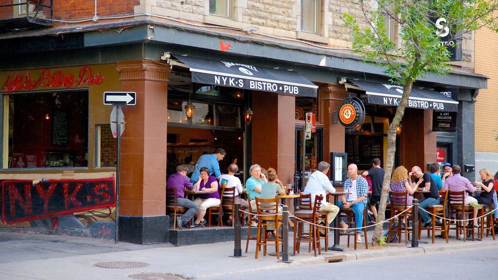 Downtown Montreal showing drinks or beverages, café scenes and signage