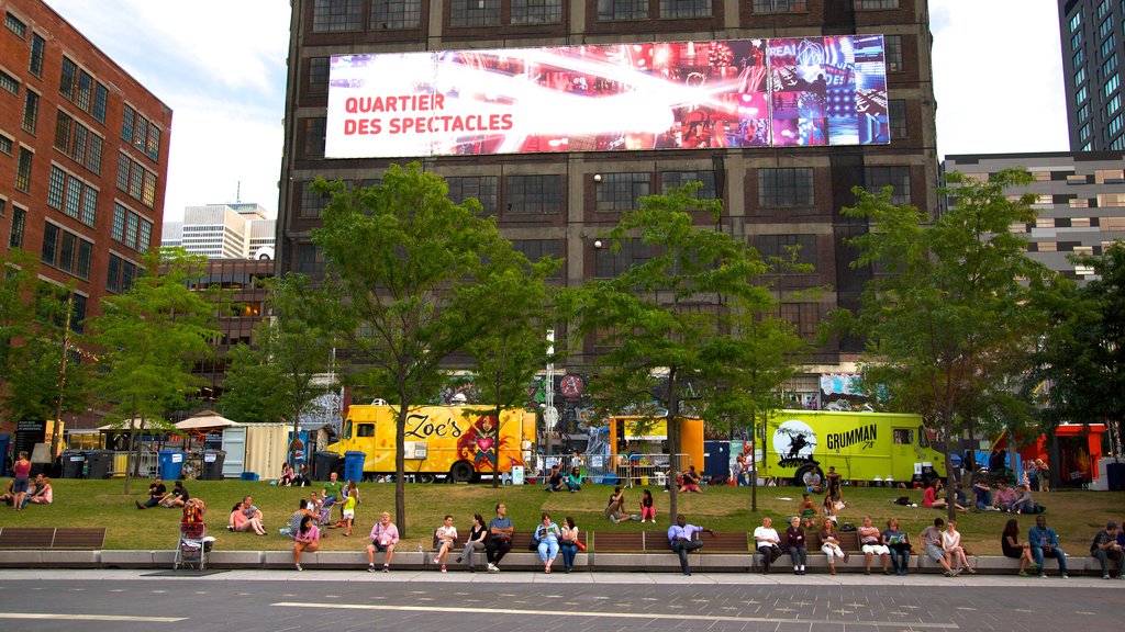 Downtown Montreal which includes street scenes, signage and a square or plaza