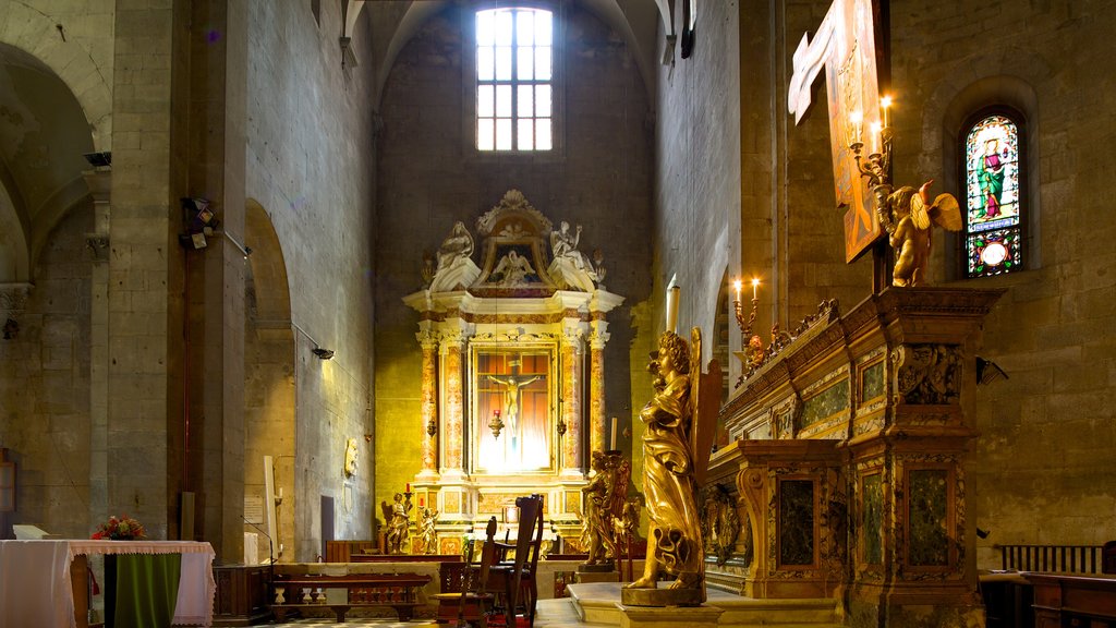 Piazza San Michele showing religious elements, a church or cathedral and interior views