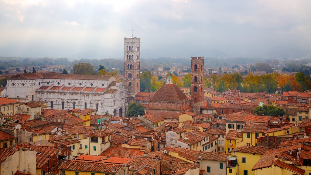 Torre delle Ore which includes heritage architecture and a city