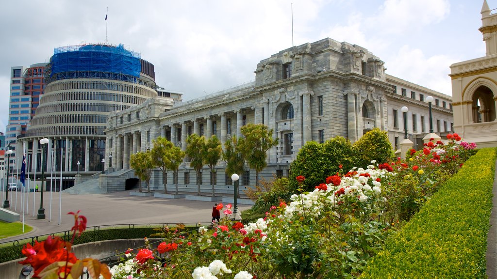 Wellington Parliament which includes flowers and heritage architecture