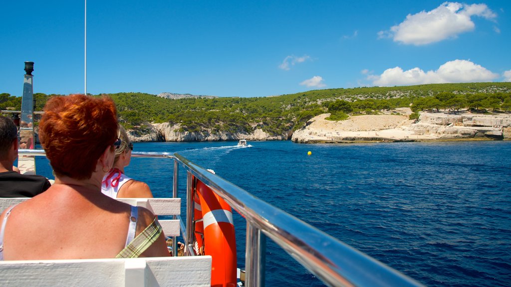 Calanques showing rugged coastline and boating