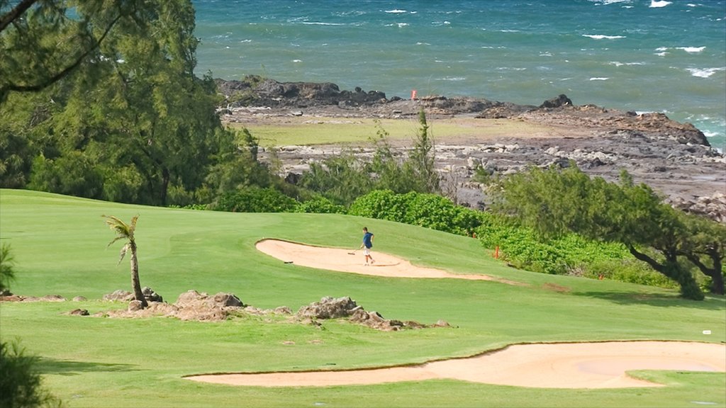 Kapalua Beach showing rocky coastline and golf