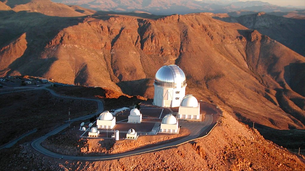 Kitt Peak National Observatory showing mountains, an observatory and a sunset