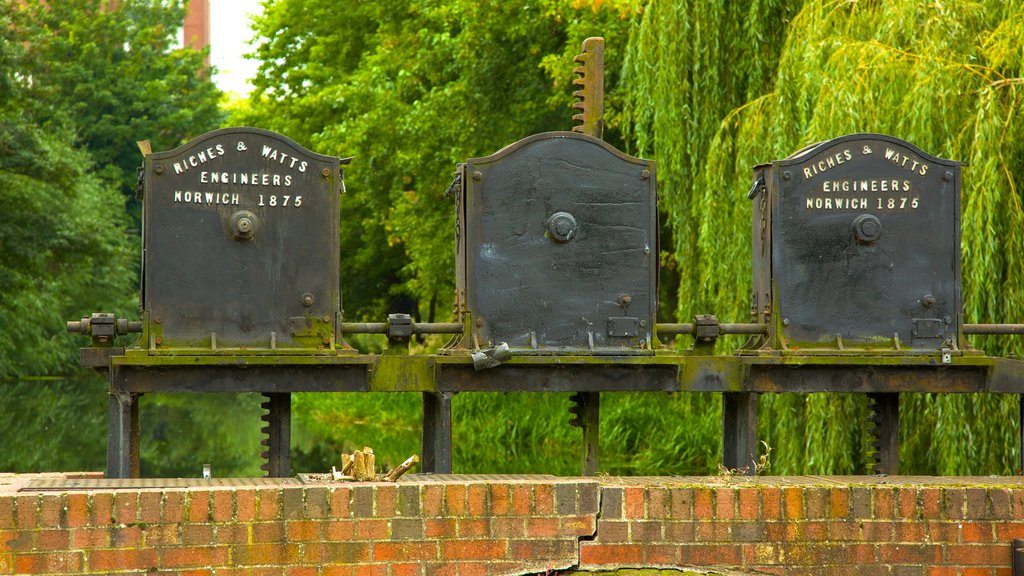 Colchester Castle Park featuring a garden and signage