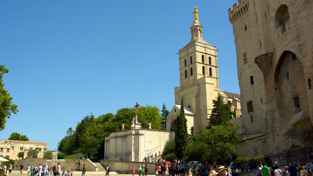 Palais des Papes featuring heritage architecture, heritage elements and a square or plaza