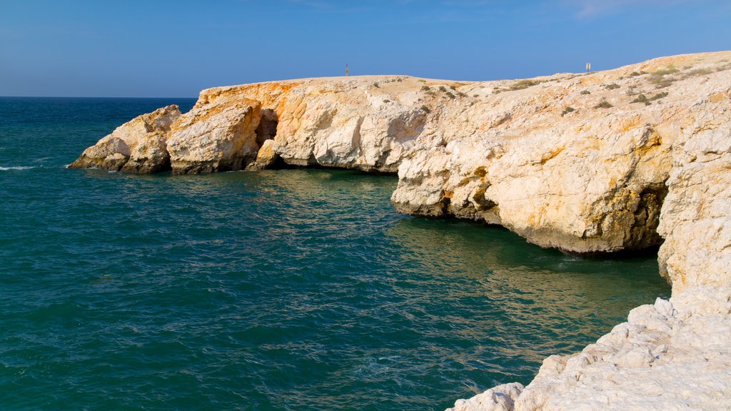 Shatti Al Qurum featuring rugged coastline