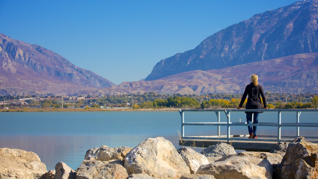 Utah Lake State Park which includes views, a lake or waterhole and mountains