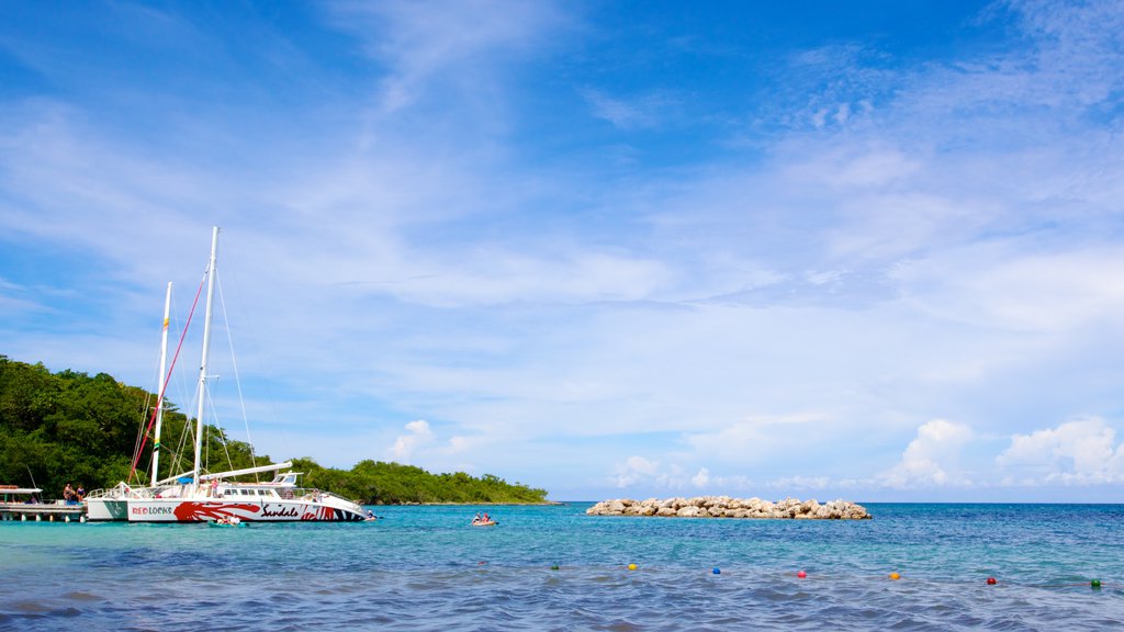 Dunn\'s River Falls showing a bay or harbour, boating and general coastal views