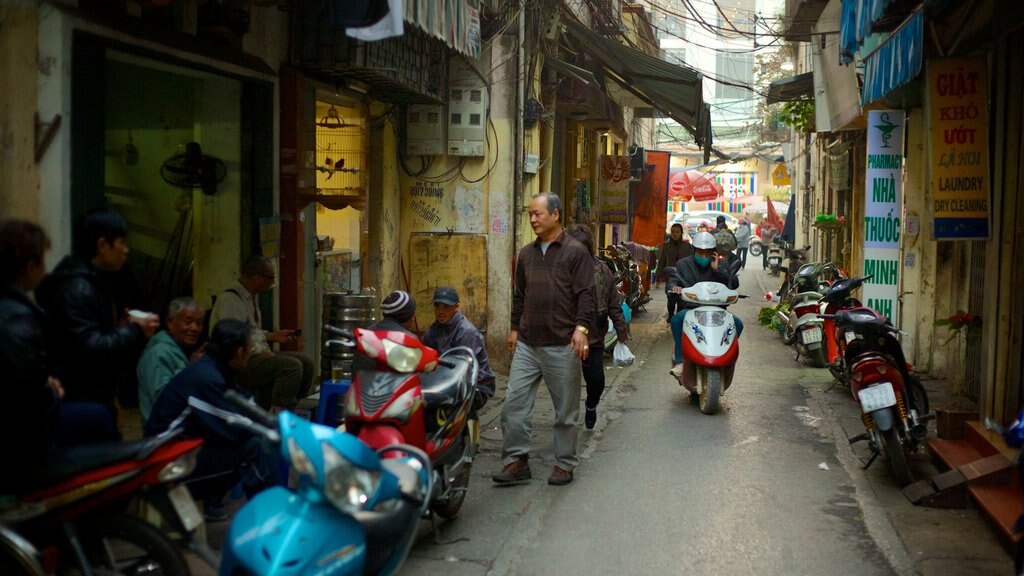 Hanoi which includes street scenes, motorcycle riding and a city