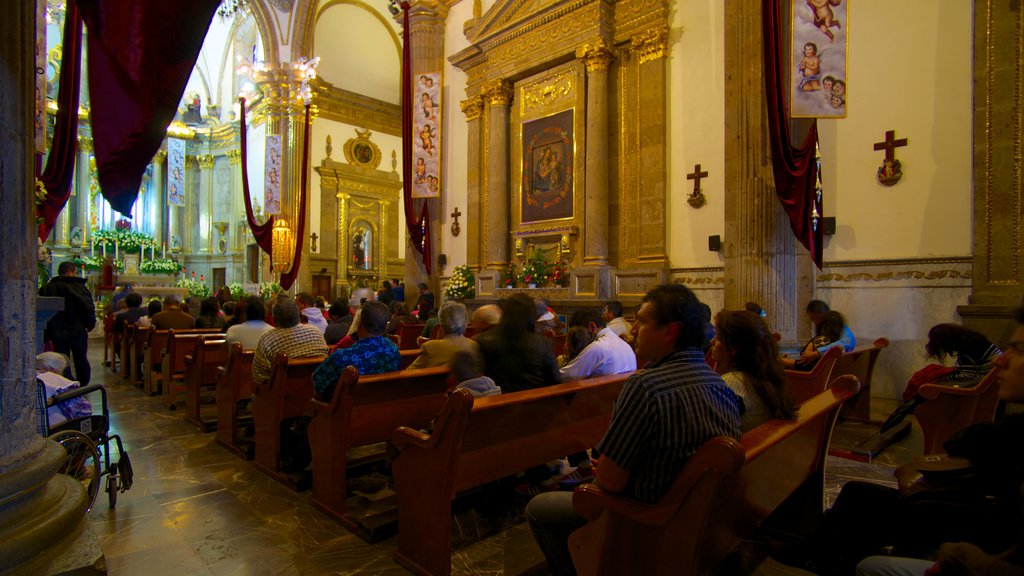 Basilica de Zapopan featuring a church or cathedral, religious elements and interior views