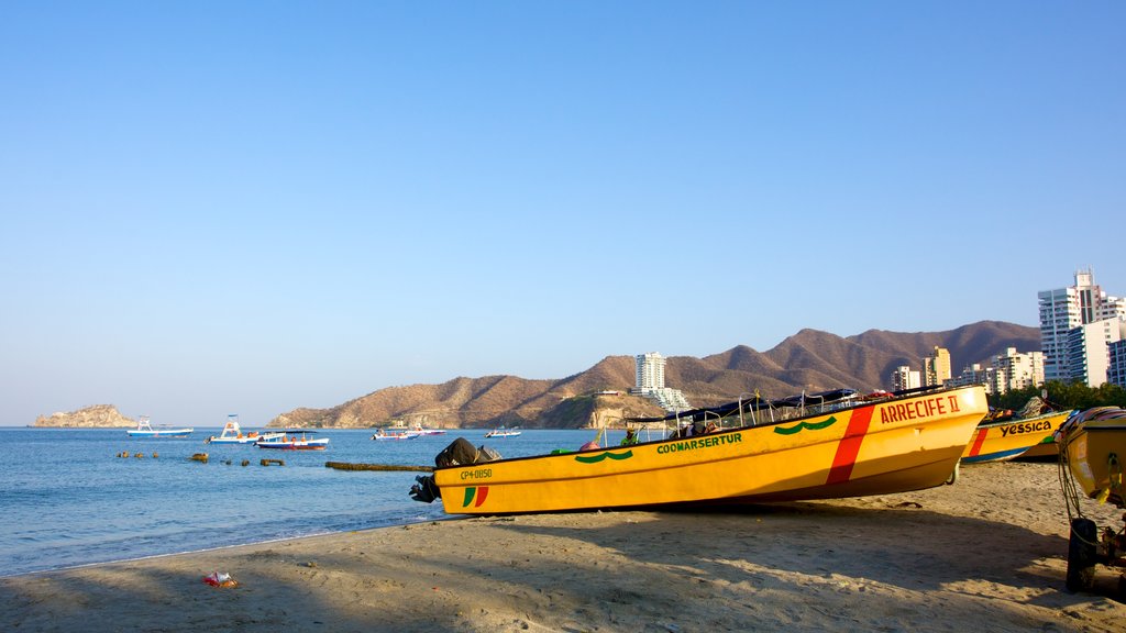 Rodadero Beach which includes a sandy beach, a coastal town and boating