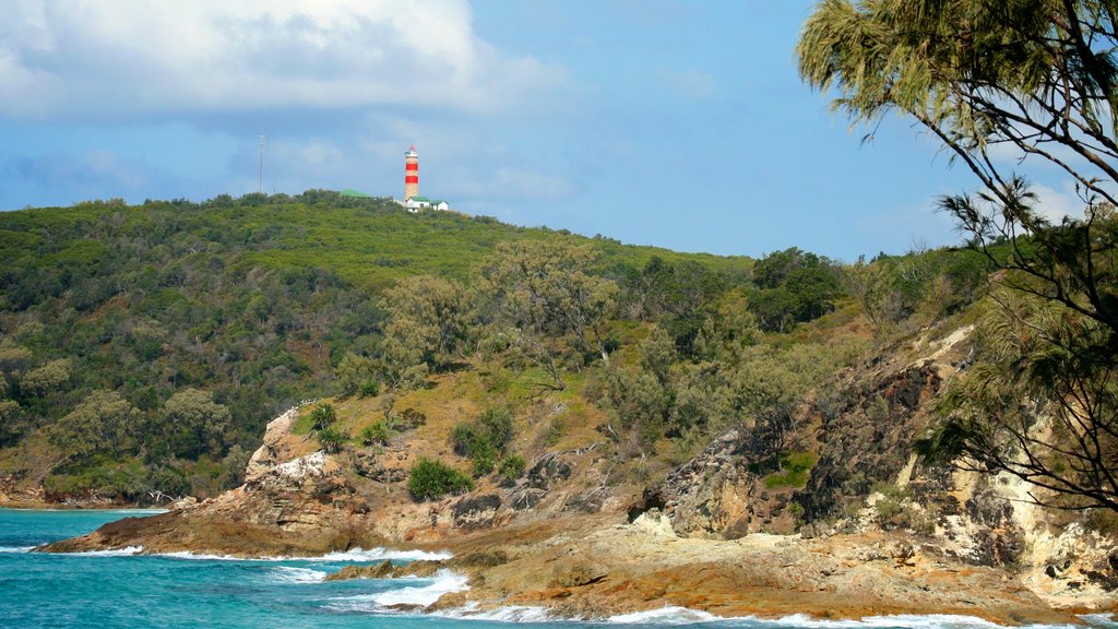 Moreton Island National Park featuring rocky coastline, landscape views and a lighthouse