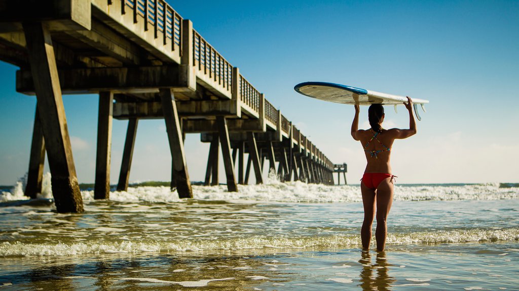 Jacksonville Beach Pier showing general coastal views as well as an individual female