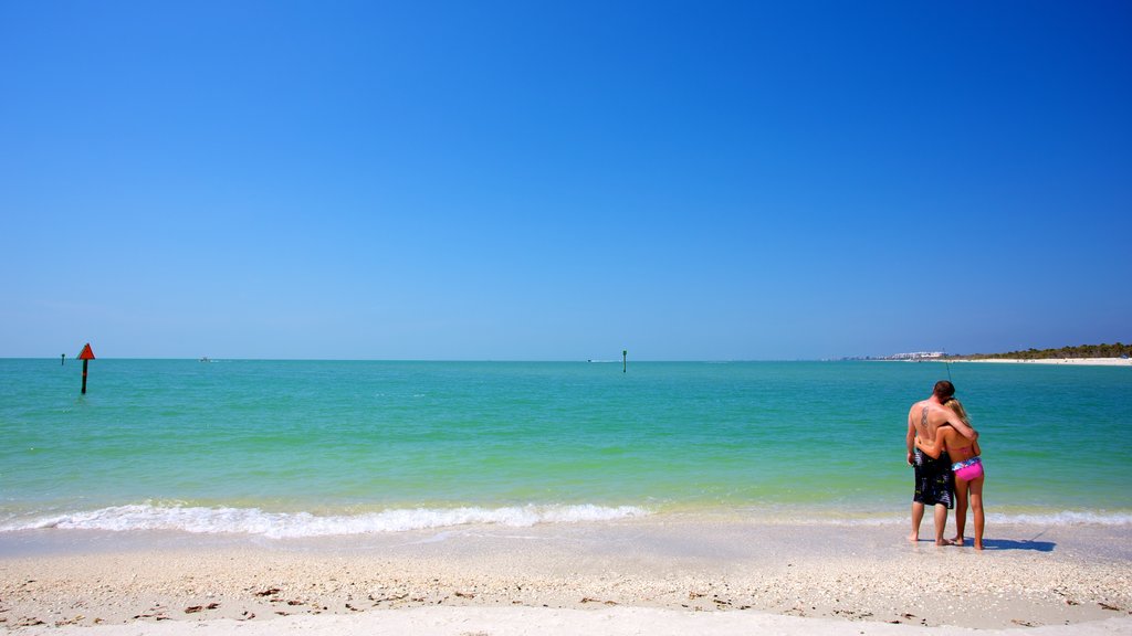 Delnor-Wiggins Pass State Park featuring general coastal views and a sandy beach as well as a couple