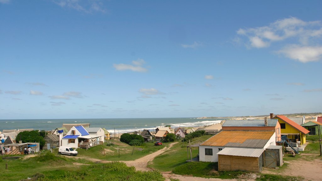 Punta del Diablo showing a coastal town and a house