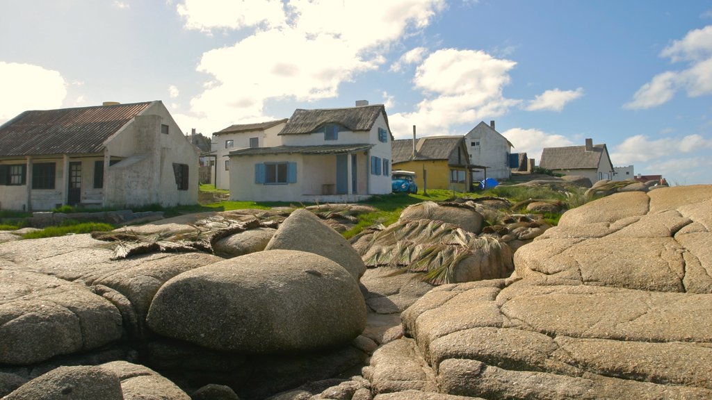 Punta del Diablo which includes a small town or village and a house