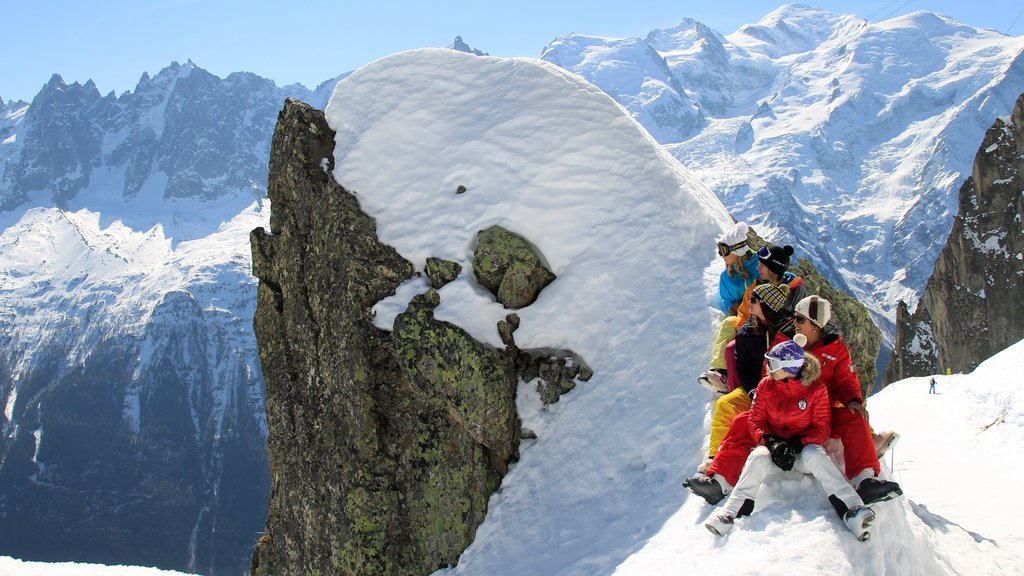 Chamonix-Mont-Blanc which includes mountains and snow as well as a small group of people