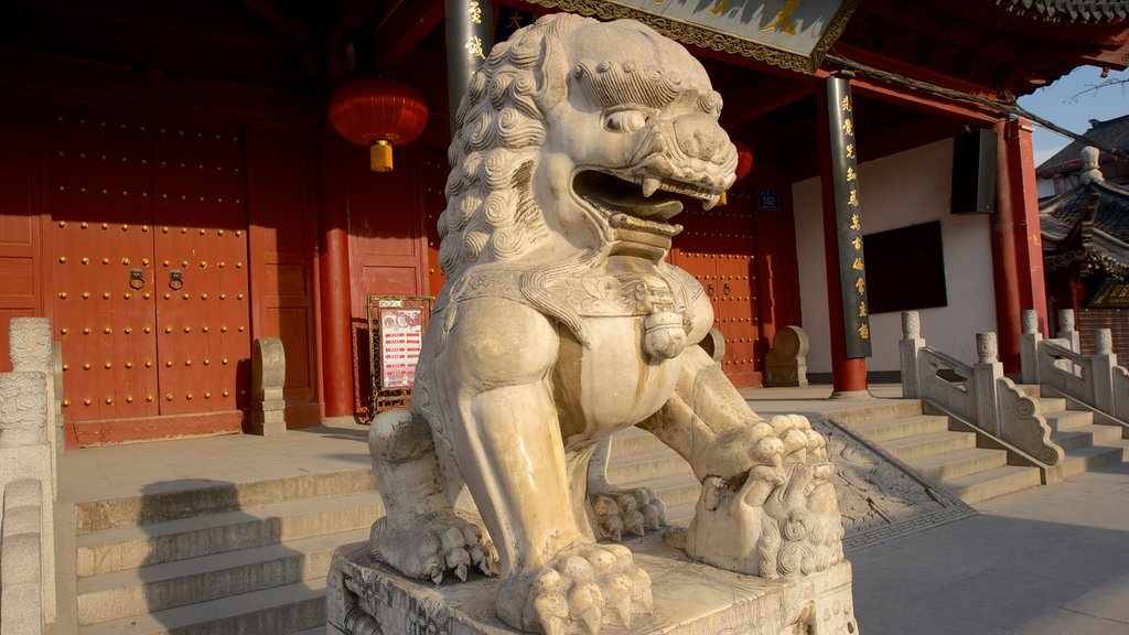 Temple of Confucius which includes a statue or sculpture, a temple or place of worship and religious elements