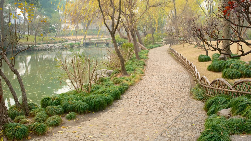 Suzhou featuring a garden and a pond