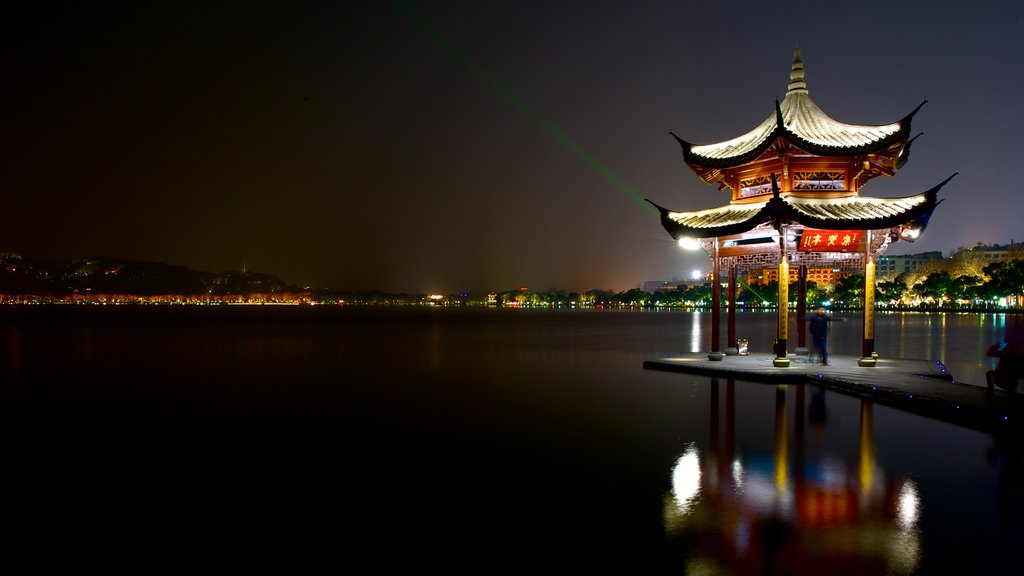 West Lake which includes night scenes and a river or creek