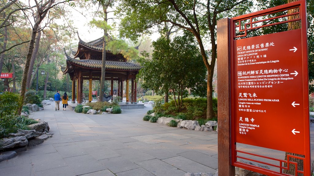 Lingyin Temple showing signage, a temple or place of worship and religious elements