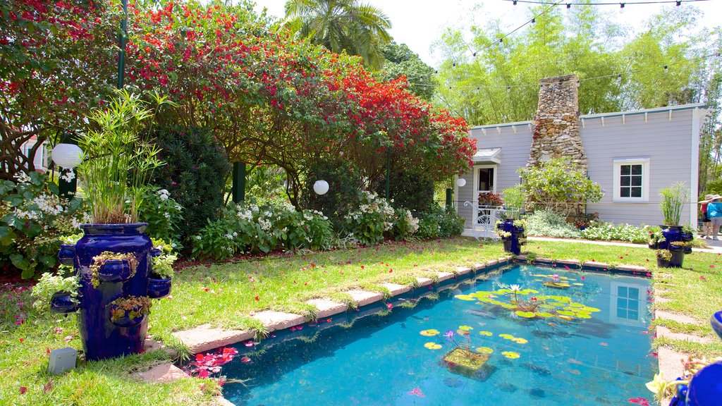 Edison and Ford Winter Estates featuring a garden, a pond and a pool