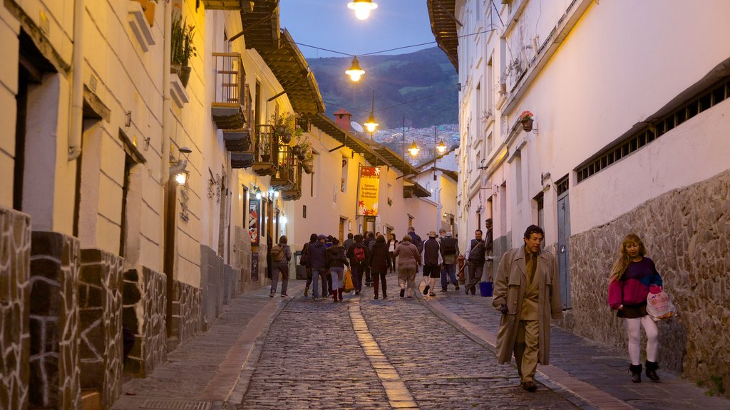 Calle La Ronda showing night scenes and street scenes as well as a large group of people