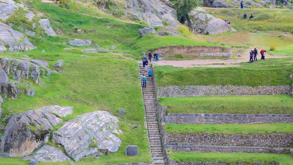 Sacsayhuaman which includes hiking or walking and heritage elements