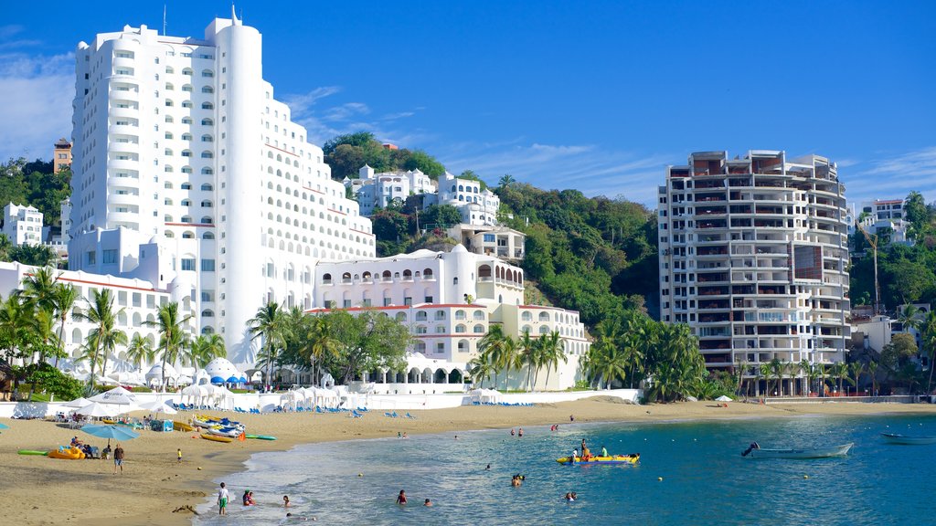 Playa La Audiencia showing tropical scenes, a hotel and a luxury hotel or resort