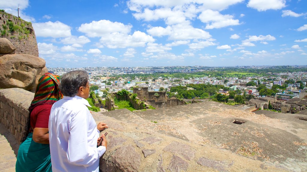 Golconda Fort showing views and a city as well as a couple