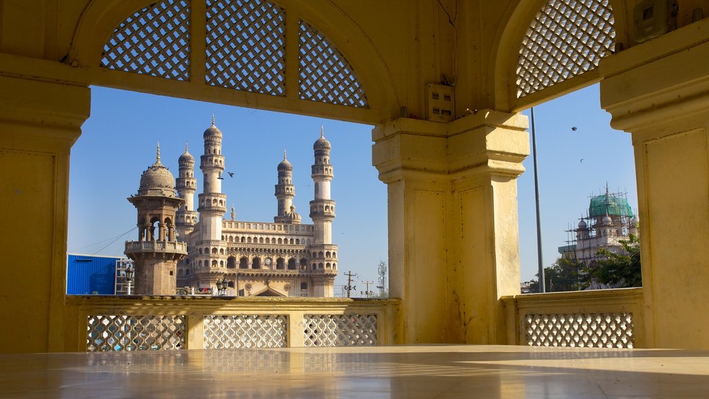 Mecca Masjid featuring heritage architecture, a mosque and interior views