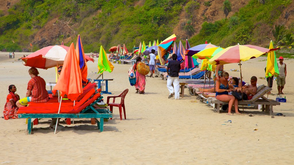 Kalacha Beach featuring a sandy beach as well as a large group of people