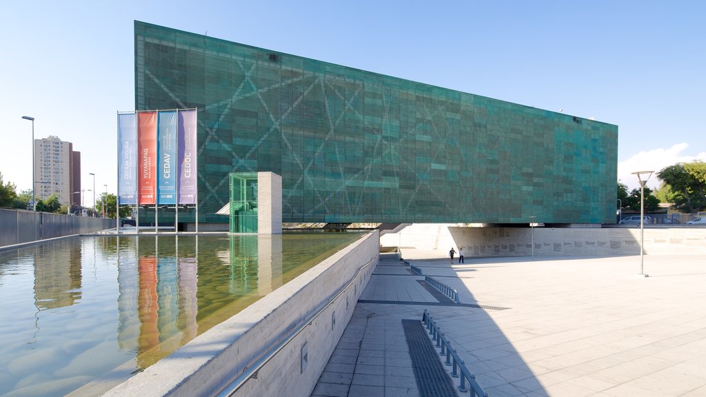 Museum of Memory and Human Rights showing modern architecture, a square or plaza and a pond