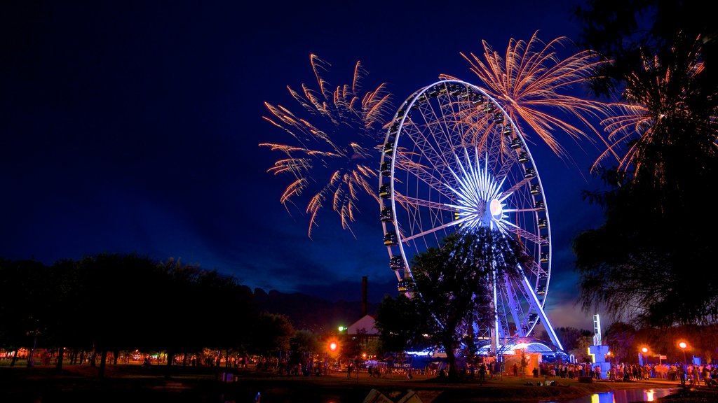 Fundidora Park showing night scenes, a park and rides