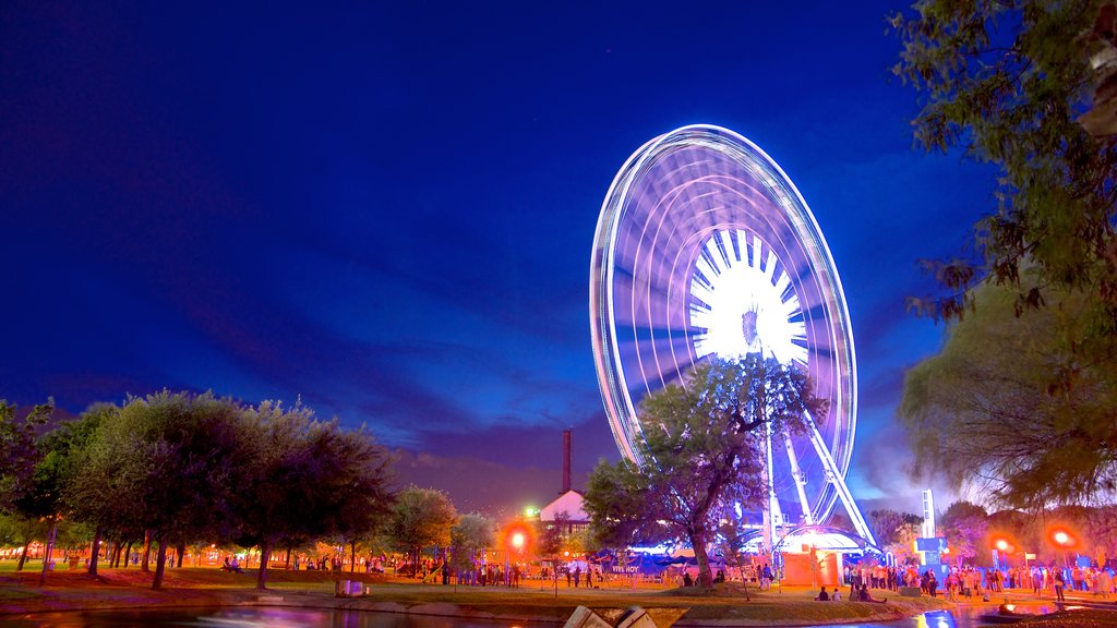 Fundidora Park featuring rides, night scenes and a garden