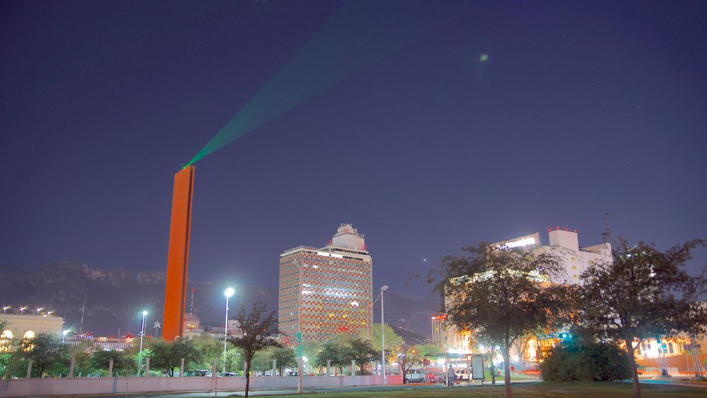 Faro de Comercio showing skyline, a monument and a city