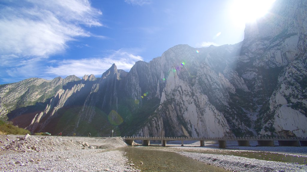 Canon de la Huasteca which includes a bridge, a river or creek and mountains