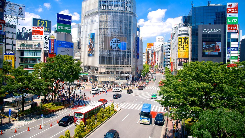 Shibuya Crossing which includes modern architecture, signage and a city