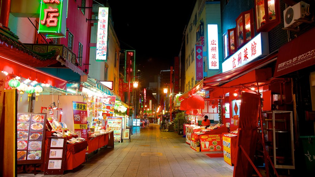 Chinatown showing a city, street scenes and signage