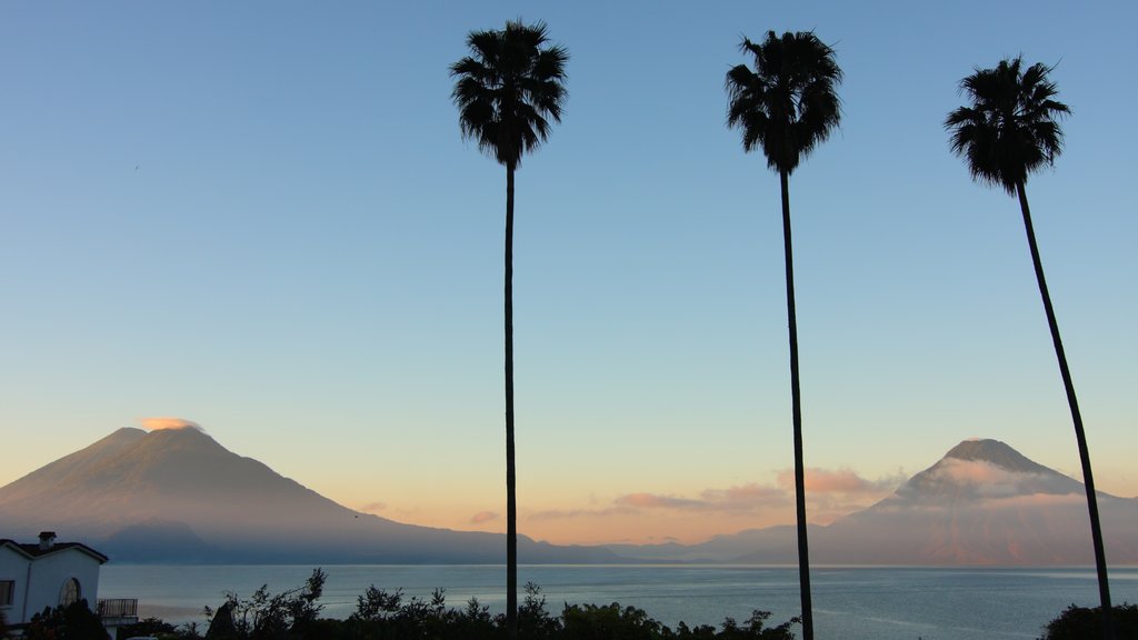 Lake Atitlan featuring a sunset, landscape views and general coastal views