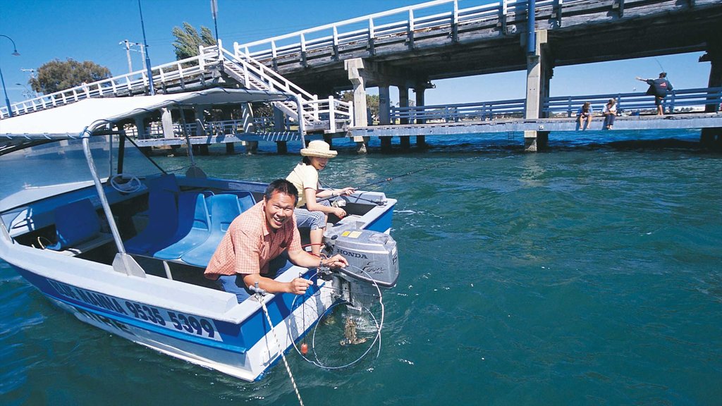 Mandurah showing a bay or harbour and boating as well as a couple