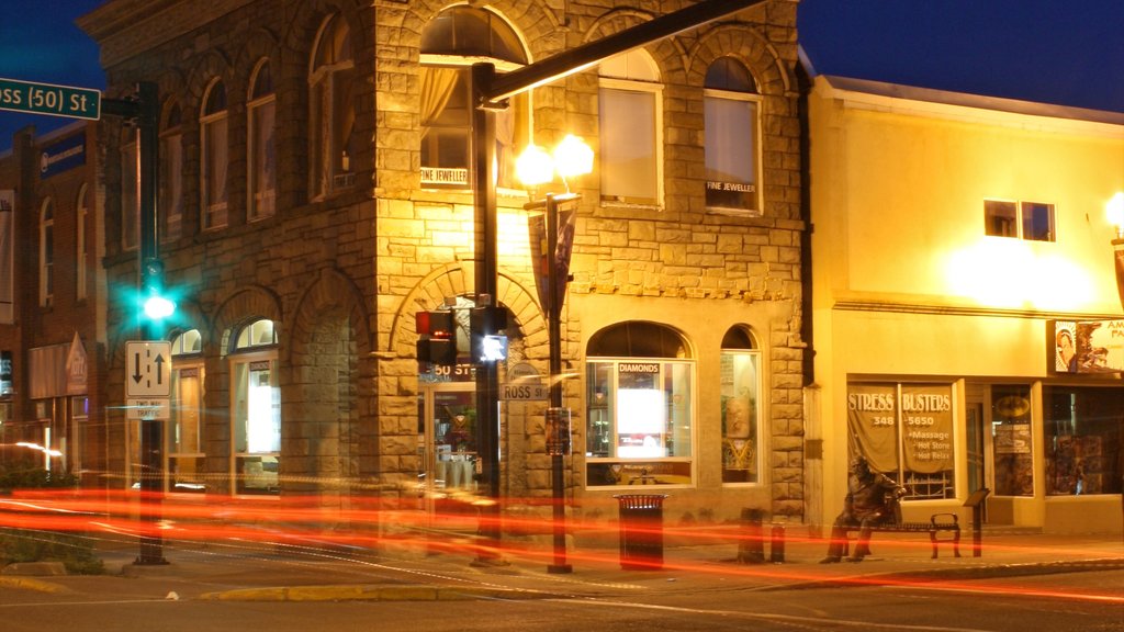 Red Deer showing signage, night scenes and heritage architecture