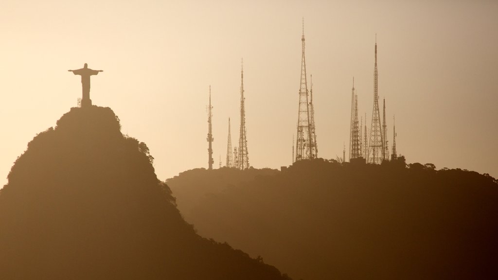 Sugar Loaf Mountain which includes a sunset and a statue or sculpture